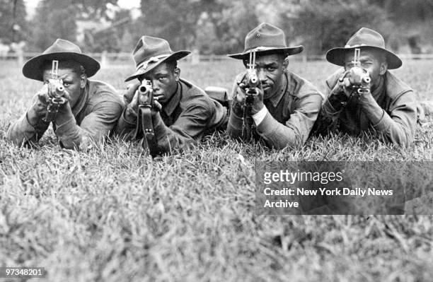 Pvts. Earl Martin, Tony Hernandez, Thomas Shriner, and Victor Rossa, of the 369th Infantry Regiment, train at Camp Smith in Peekskill, N.Y. The 369th...