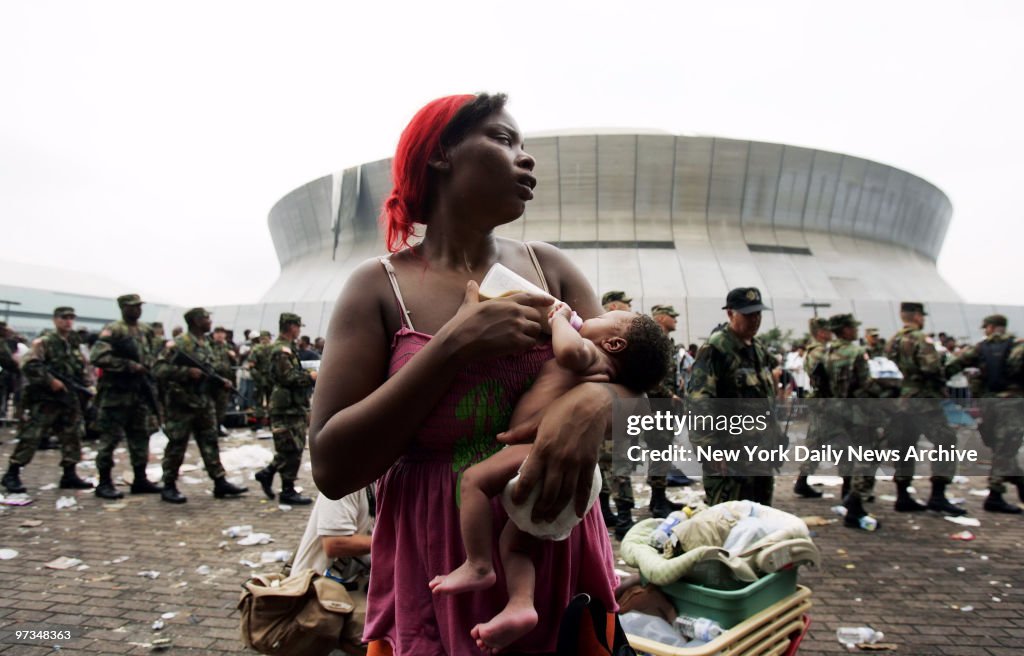 Quintella Williams feeds her 9-day-old baby girl, Akea, outs