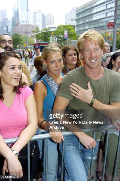 radio-personality-gregg-hughes-of-xm-radios-opie-and-anthony-show-and-a-friend-wait-outside.jpg