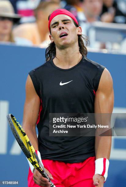 Rafael Nadal is upset after losing a point during his 2006 U.S. Open quarterfinal match against Mikhail Youzhny at Louis Armstrong Stadium in...
