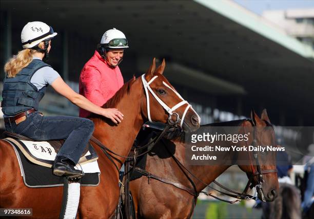 Rags to Riches with exercise rider Lauren Robson and Bandit with Bandit with outrider Anna Seitz are on the track at Belmont Park during morning...