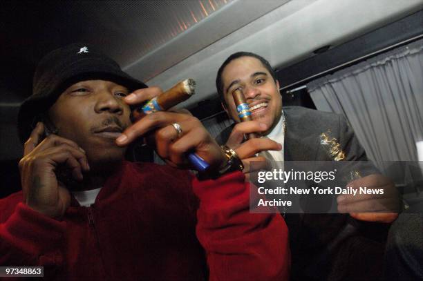 Rapper Ja Rule and Murder Inc. Record label head Irving Lorenzo celebrate by smoking some cigars in a van outside Brooklyn Federal Court after...