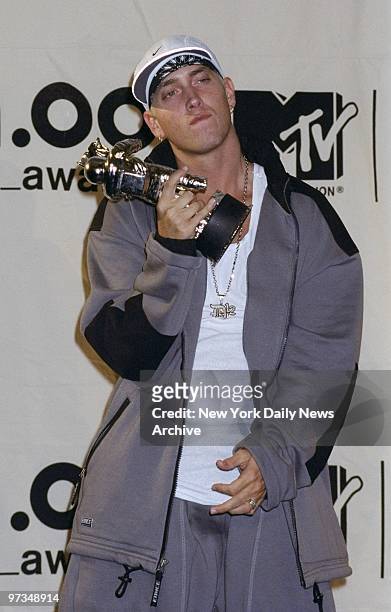 Rapper Marshall Mathers, aka Eminem, shows his award backstage at the MTV Music Video Awards 2000 at Radio City Music Hall. He won for Best Male...