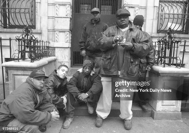 Rapper Notorious B.I.G., aka Biggie Smalls, aka Chris Wallace with Junior Mafia outside his mother's house in Brooklyn.