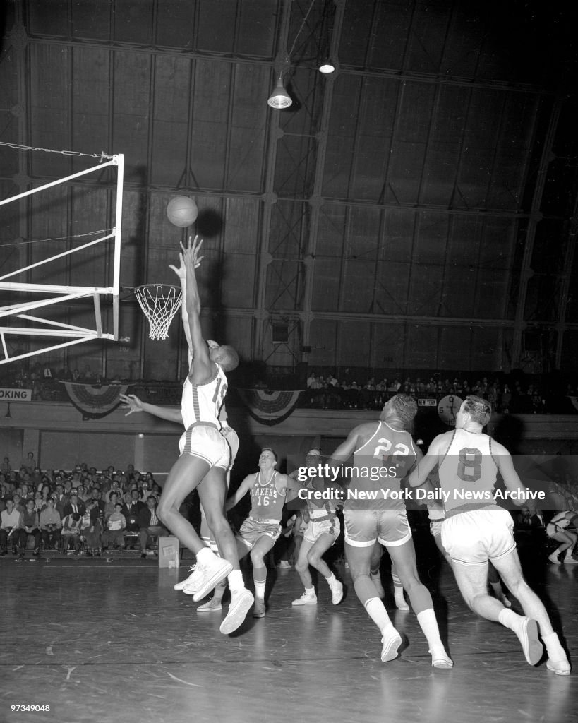 Ray Felix of Knicks tries to toss in Two Pointer in first pe