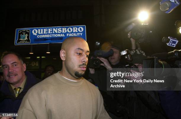 Raymond Santana, the last of the Central Park jogger defendants, is escorted from the Queensboro Correctional Facility in Long Island City. Santana...