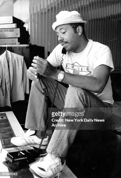 Record producer Russell Simmons on the phone at 111 Barrow St. "Simmons is rarely without hat or phone"