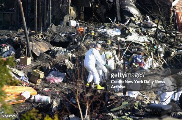 Recovery teams continue the search for bodies at the crash scene of American Airlines Flight 587. The Airbus A300 went down in Belle Harbor, Queens,...