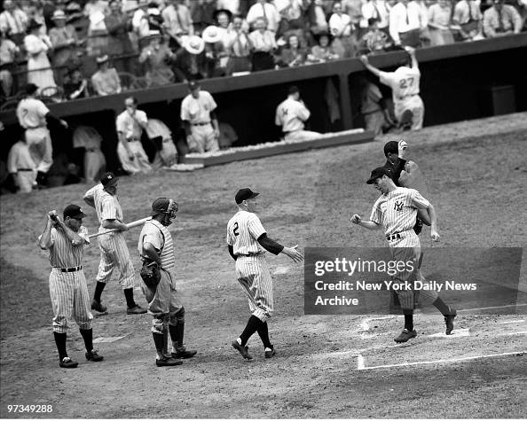 Red Rolfe greets Joe DiMaggio after Yankee Clipper belts hom Red Rolfe greets Joe DiMaggio after Yankee Clipper belts hom