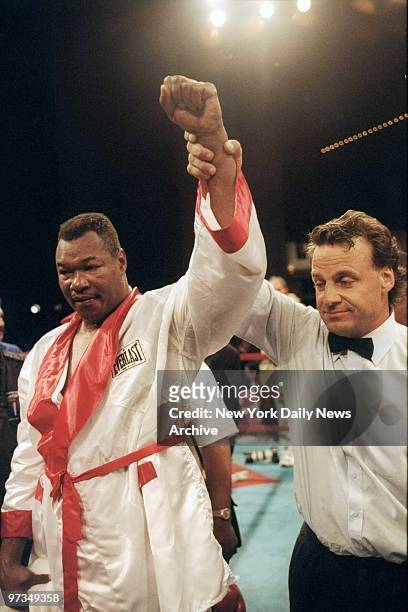 Referee raises Larry Holmes' hand after he defeated Maurice Harris at Madison Square Garden.