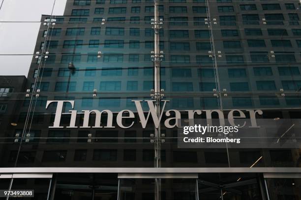 Signage is displayed outside the Time Warner Center in New York, U.S., on Wednesday, June 13, 2018. AT&T Inc.'s sweeping court victory allowing its...