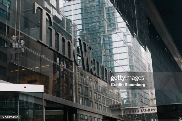 Signage is displayed outside the Time Warner Center in New York, U.S., on Wednesday, June 13, 2018. AT&T Inc.'s sweeping court victory allowing its...