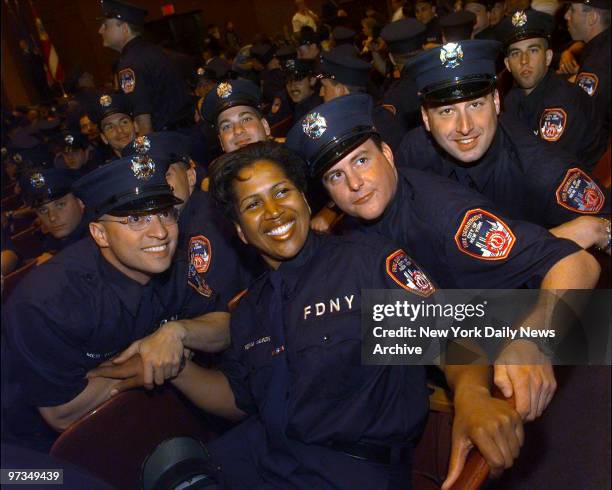 Regina Wilson, with fellow graduates at Brooklyn College, joins just 10 other black women in 11,000-member Fire Department. She was the only woman in...