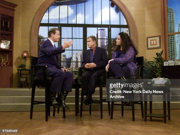 Regis Philbin and guest host Rhonda Jamgochian look on as Vice President Al Gore speaks on 'Live With Regis," where the Democratic presidential...
