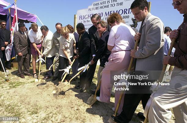 Relatives of the victims of TWA Flight 800 dig in at groundbreaking for a monument overlooking the crash site at Smith Point Park on Fire Island....