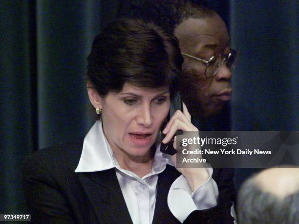 Rep. Mary Bono keeps in touch by cell phone at the House Judiciary Committee hearings on whether to impeach President Clinton.