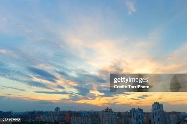cloud sunset sky above kiev (pozniaky district) - golden clouds stock-fotos und bilder