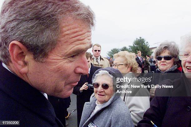 Republican presidential hopeful George W. Bush, governor of Texas, greets supporters at Kent County Airport in Dover. Bush is starting a four-day...