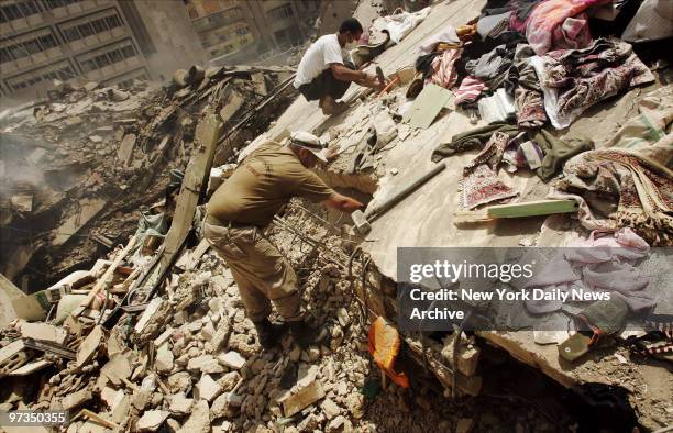 Rescue workers search for survivers in a vast pile of rubble at a site in southern Beirut, Lebanon, where Israeli bombs leveled nine residential...