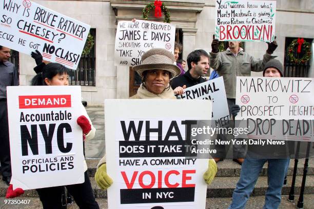 Residents and activists demonstrate outside Brooklyn Borough Hall where plans were unveiled for a 20,000-seat arena that woud be the centerpiece of a...