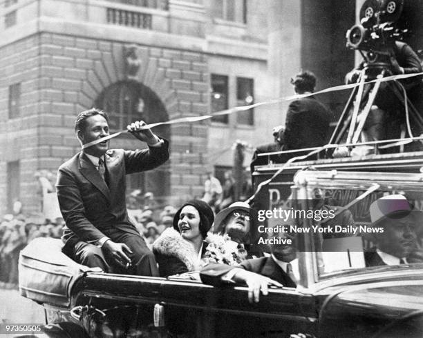 Returning with British Open and amateur golf championships, Bobby Jones received huge New York welcome. This ticker tape streamer ensnared him as he...