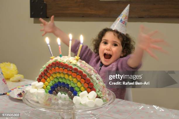 small girl celebrating her 4th birthday - not guilty stock pictures, royalty-free photos & images