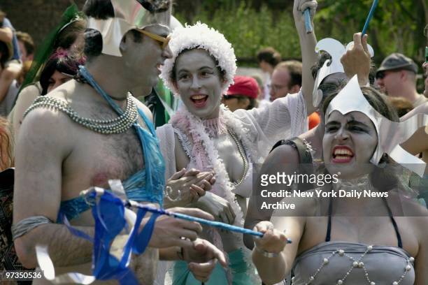 Revelers entertain the crowd on Neptune Ave. In Coney Island during the annual Mermaid Parade.
