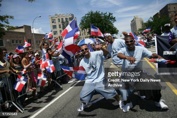 Revelers march during the Dominican Day Parade on the Grand Concourse in the Bronx.
