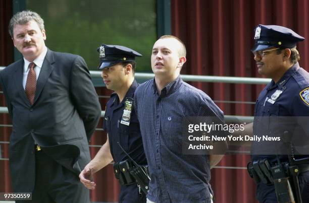 Richard Markham, who confessed to killing and dismembering his friend in England before fleeing to New York, is led out of the Central Park Precinct...
