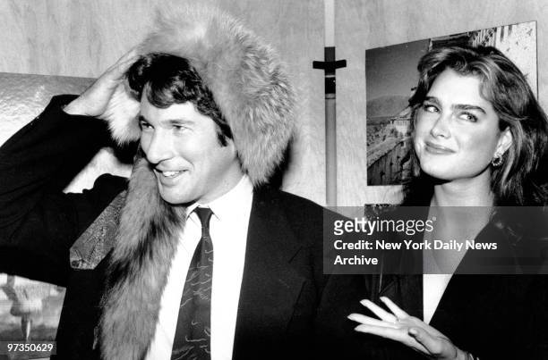 Ricard Gere tried on Tibetan fur hat to the delight of Brooke Shields at the Newark Museum. Gere was an honorary chairman for the museum's "Night in...