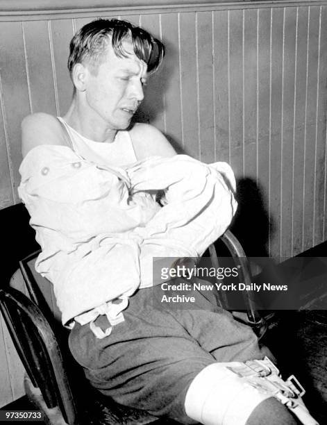 Richard Cross is constrained in a straitjacket at the 114th Precinct stationhouse. Police, believing he had a shotgun, used teargas to force him out...