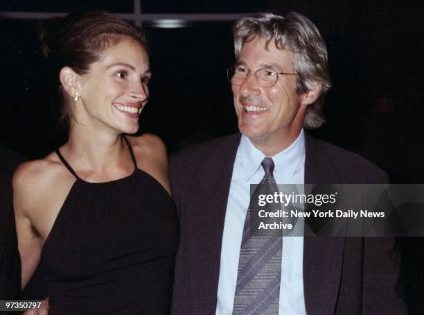 Richard Gere gets together with actress Julia Roberts at Amnesty International USA's Second Annual Media Spotlight Awards dinner. Gere received a...