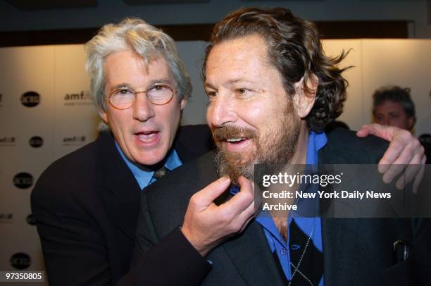 Richard Gere tickles the beard of artist Julian Schnabel during a benefit at Sotheby's to posthumously recognize photographer Herb Ritts for his work...