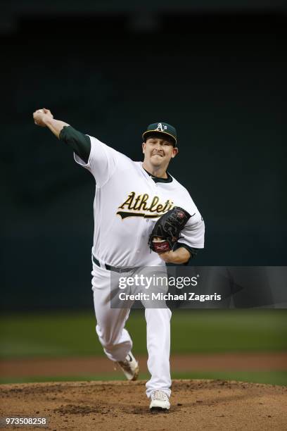 Trevor Cahill of the Oakland Athletics pitches during the game against the Seattle Mariners at the Oakland Alameda Coliseum on May 22, 2018 in...