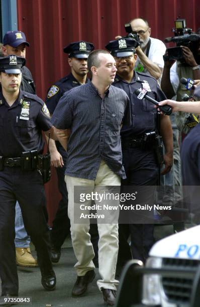 Richard Markham, who confessed to killing and dismembering his friend in England before fleeing to New York, is approached by media as he's led out...