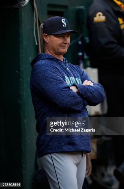 Manager Scott Servais of the Seattle Mariners stands in the dugout during the game against the Oakland Athletics at the Oakland Alameda Coliseum on...