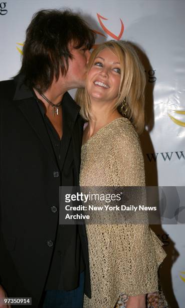Richie Sambora smooches wife Heather Locklear during "A Funny Thing Happened on the Way to Cure Parkinson's..." at the Waldorf-Astoria. The evening...