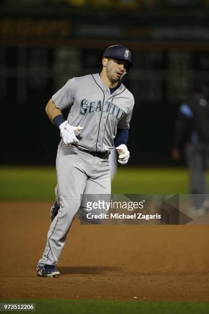 Mike Zunino of the Seattle Mariners runs the bases after hitting a home run during the game against the Oakland Athletics at the Oakland Alameda...