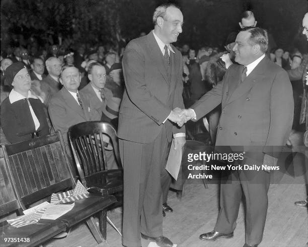 Robert Moses, Republican candidate for Governor, and Mayor Fiorello LaGuardia shake hands at last night's final rally in Madison Square Garden.