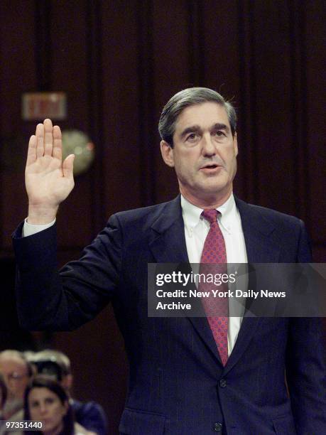 Robert Mueller, the President's nominee to head the FBI, is sworn in at the start of his confirmation hearing before the Senate Judiciary Committee.