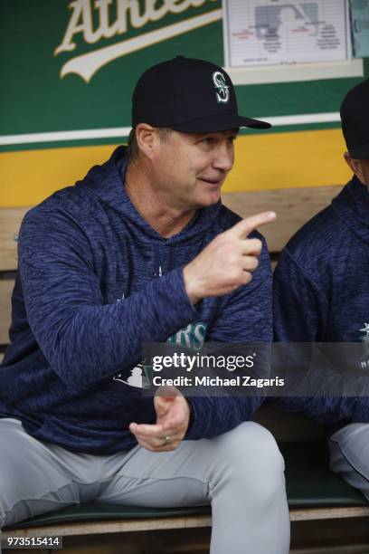 Manager Scott Servais of the Seattle Mariners sits in the dugout prior to the game against the Oakland Athletics at the Oakland Alameda Coliseum on...