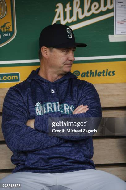 Manager Scott Servais of the Seattle Mariners sits in the dugout prior to the game against the Oakland Athletics at the Oakland Alameda Coliseum on...