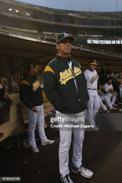 Manager Bob Melvin of the Oakland Athletics stands in the dugout during the game against the Seattle Mariners at the Oakland Alameda Coliseum on May...