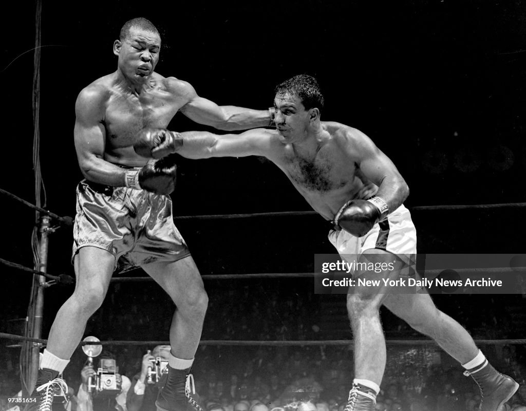 Rocky Marciano s Eyes Glint Confidently After He Drives A Tremendous rocky-marciano-s-eyes-glint-confidently-after-he-drives-a-tremendous
