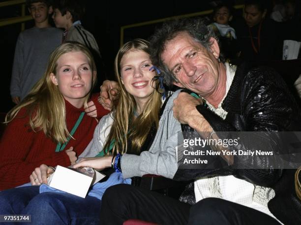 Rock legend Keith Richards huddles with his daughters, Alexandra and Theodora, at a Memorial Sloan-Kettering Cancer Center benefit screening of the...