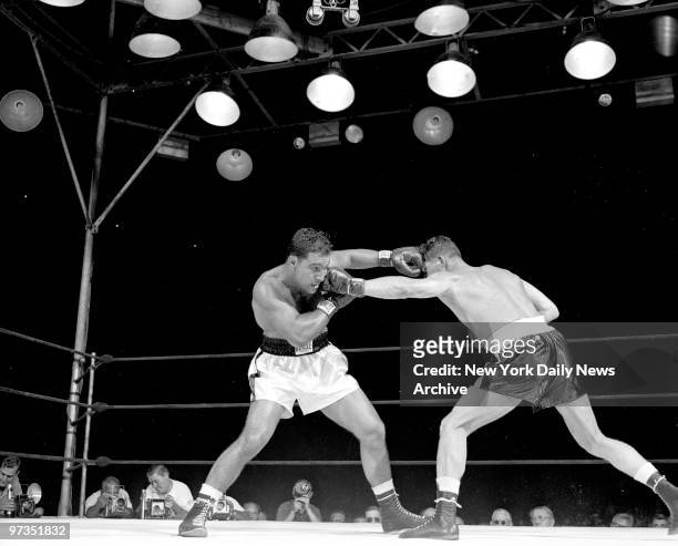 Rocky Marciano trades lefts with Harry Matthews at Yankee Stadium.
