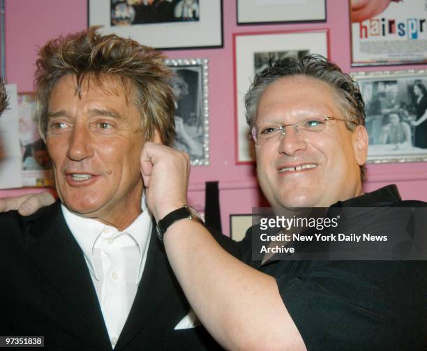 Rod Stewart lends an ear to Harvey Fierstein during a dressing-room get-together at the Neil Simon Theater, where Fierstein is starring in...