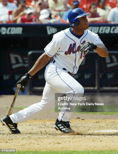 Roger Cede?o watches the ball leave the park as he belts a pinch-hit, two-run homer for the New York Mets in the seventh inning of a game against the...
