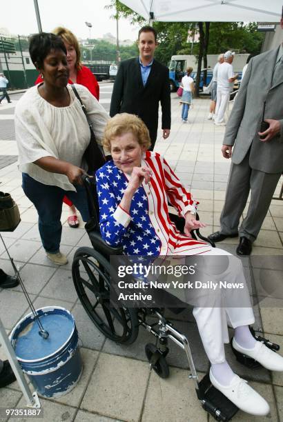 Roger Clemens' mother, Bess, is decked out in stars and stripes as she arrives at Yankee Stadium to see her son pitch as the New York Yankees take on...