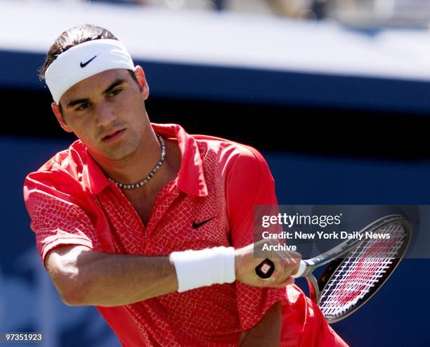 Roger Federer hits a return against Andre Agassi in the U.S. Open at Flushing Meadows-Corona Park in Queens. Agassi won in straight sets.